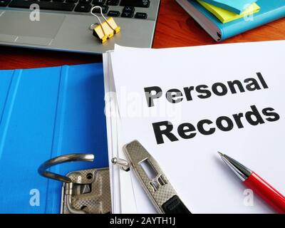 Blue office folder with Personal Records on the desk. Stock Photo