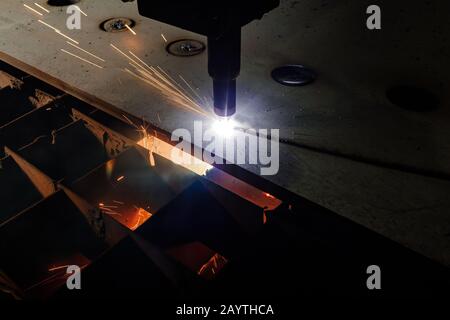 Plasma cutting of metal with a cnc. Plasma cutting machine cutting steel sheet. Laser cutter in production. Industrial metal cutting by plasma laser Stock Photo