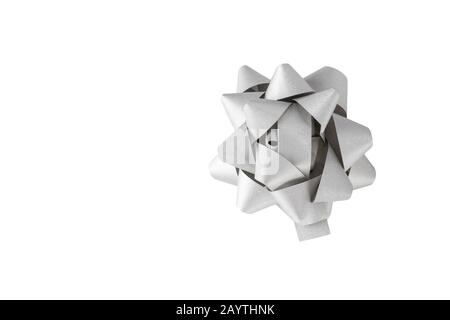 Silver Christmas festive bow on white background. Stock Photo
