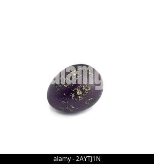 Easter Egg, one violet colored quail egg on white Stock Photo