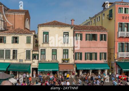 Venice, Italy- September 27, 2013: Venetian street with shops and crowds of tourists Stock Photo