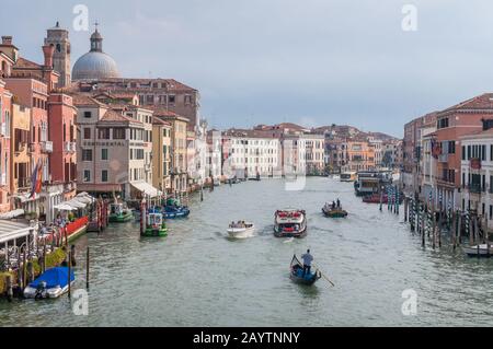 Venice, Italy - September 27, 2013: Grand Canal with gondoliers and boats and historic buildings Stock Photo