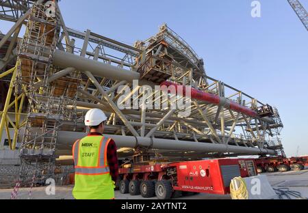 Doha. 16th Feb, 2020. Photo taken on Feb. 16, 2020 shows banners reading ''Wuhan be strong' and 'China keep going' at the construction site of the Lusail Stadium, one of the 2022 FIFA World Cup stadiums, in Lusail, Qatar. The installation of the main steel frame of Lusail Stadium, built by China Railway Construction Corporation (CRCC), completed on Sunday. Credit: Nikku/Xinhua/Alamy Live News Stock Photo