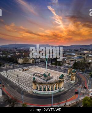 Budapest, Hungary - Aerial drone view of beautiful Heroes' Square and Millennium Monument with Museum of Fine Arts and a beautiful golden sunset sky Stock Photo