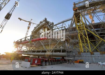 Doha. 16th Feb, 2020. Photo taken on Feb. 16, 2020 shows banners reading ''Wuhan be strong' and 'China keep going' at the construction site of the Lusail Stadium, one of the 2022 FIFA World Cup stadiums, in Lusail, Qatar. The installation of the main steel frame of Lusail Stadium, built by China Railway Construction Corporation (CRCC), completed on Sunday. Credit: Nikku/Xinhua/Alamy Live News Stock Photo