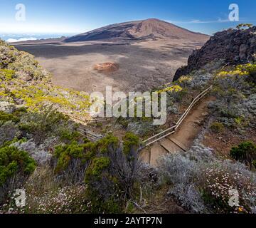 Hiking trail into the Caldeira of volcano Piton de la Fournaise at island La Reunion Stock Photo