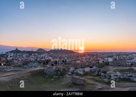 People watching sunset from Nebet tepe Hill in Plovdiv city, Bulgaria - the oldest European city Stock Photo