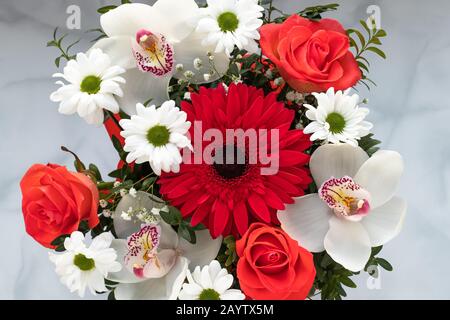 Bouquet of colorful flowers top view on gray background. Art floral gift card, nature pattern Stock Photo