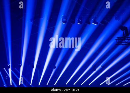 Scene, stage lights with colored spotlights and smoke, beams of lights background, white and blue Stock Photo