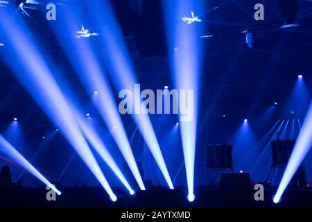 Scene, stage lights with colored spotlights and smoke, beams of lights background, white and blue Stock Photo