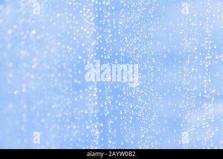 Light cold blue blurred background with water drops pattern Stock Photo