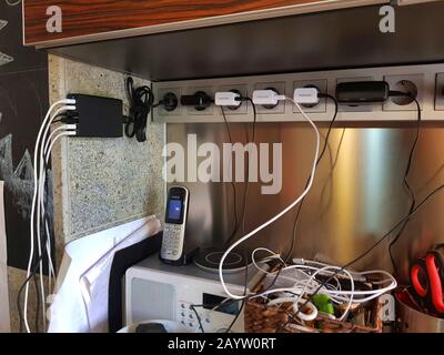 plugbar, charge cables and telephone, Germany Stock Photo