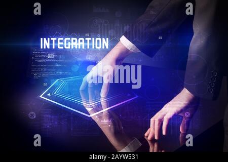 Hand touching digital table with INTEGRATION inscription, new age security concept Stock Photo