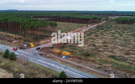 17 February 2020, Brandenburg, Grünheide: View of the already partly cleared forest area on the future site of the Tesla Gigafactory (aerial photo with a drone). Tesla is planning to build a gigafactory on this site, east of the A10 Berlin Ring motorway in the municipality of Grünheide. In a first phase from summer 2021, 150,000 Model 3 and Y electric cars are to be built there annually. Photo: Patrick Pleul/dpa-Zentralbild/dpa Stock Photo
