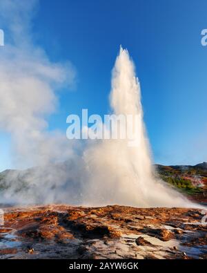 Powerful erupting of famous Strokkur geyser in southwestern Iceland, Europe. Stock Photo