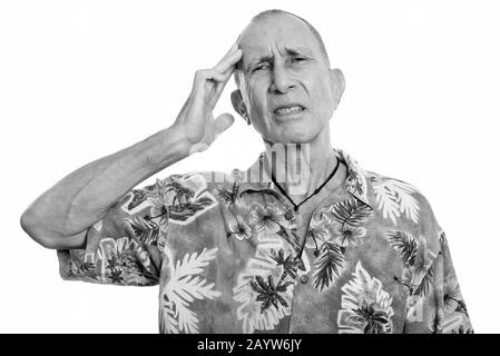 Portrait of stressed senior tourist man having headache Stock Photo