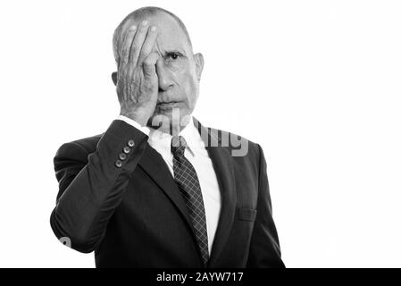 Portrait of stressed senior businessman having headache Stock Photo
