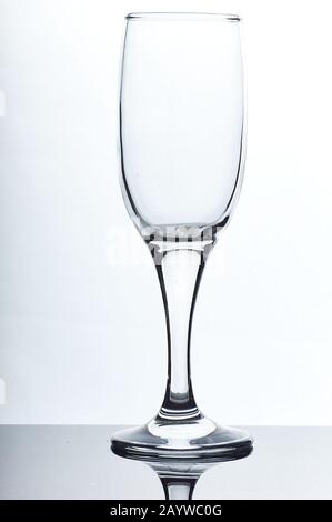 set of glass empty glasses and glasses for water and alcoholic drinks on a gray-white background Stock Photo