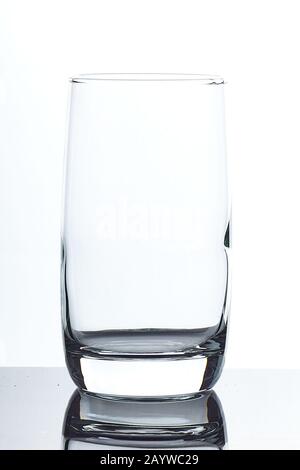 set of glass empty glasses and glasses for water and alcoholic drinks on a gray-white background Stock Photo