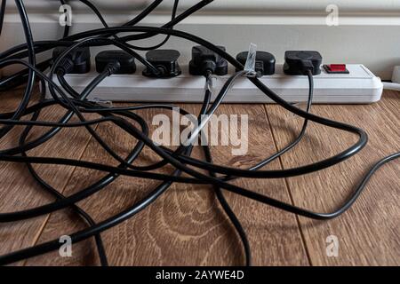 Multiple electrical plugs in a home office. Stock Photo