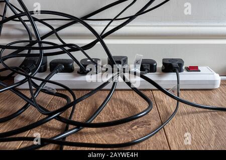 Multiple electrical plugs in a home office. Stock Photo