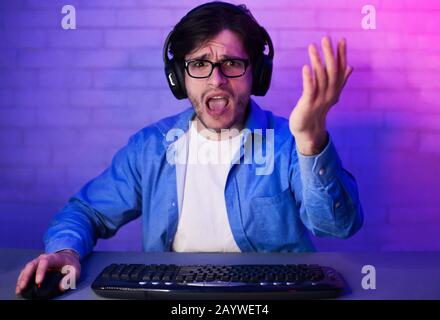 Angry Gamer Losing Game Playing Online On Computer At Home Stock Photo