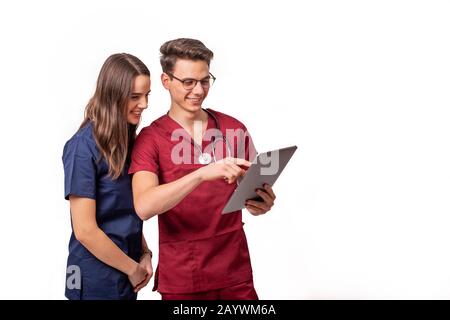 Young doctors analyzing patient results on a tablet Stock Photo