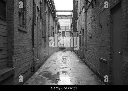 Street alley in the city on a rainy day Stock Photo