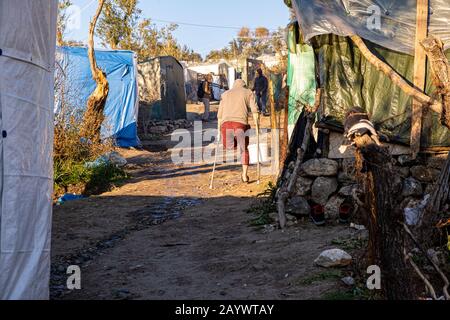 Moria Camp Lesbos Greece One legged Man on crutches Stock Photo