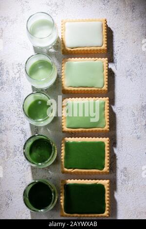Cookies in green icing.Stylish dessert.Healthy food and drink.Vintage style Stock Photo
