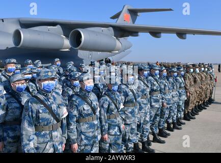 Wuhan, China's Hubei Province. 17th Feb, 2020. Military medics format after they deplaned a transport aircraft of the People's Liberation Army (PLA) Air Force at Tianhe International Airport in Wuhan, central China's Hubei Province, Feb. 17, 2020. Credit: Li He/Xinhua/Alamy Live News Stock Photo
