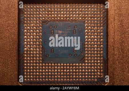 Processor pins macro. computer motherboard close up. cpu pins on a circuit board. micro elements of computer central processor unit. modern technologi Stock Photo
