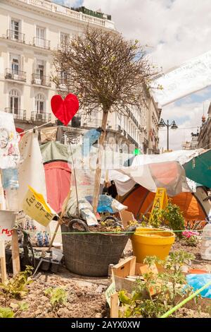 Puerta del Sol, Madrid, Spain - June 4, 2011: Tents of the peaceful social movement of the indignant, and the 15-M in the camping at Puerta del Sol. Stock Photo