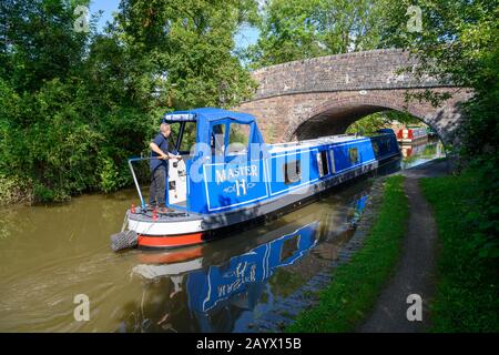 New narrowboat being taken out for its first trip along the Worcester and Birmingham Canal on a sunny summers day. Stock Photo