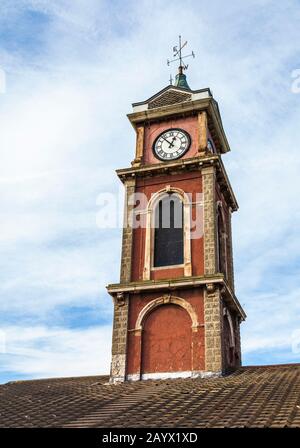 The former town hall in the St.Hildas area of Middlesbrough,England,UK with a close up of the clock tower and weather vane Stock Photo