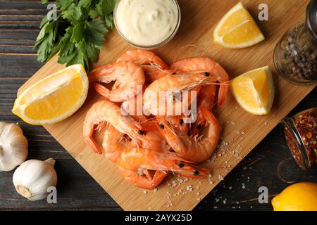 Composition with delicious shrimps on wooden background, top view Stock Photo