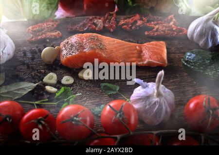 healthy fish salmon with vegetables and garlic Stock Photo