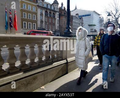 London, England, UK. Asian tourists wearing facemasks in Whitehall, Central London Jan 2020 Stock Photo