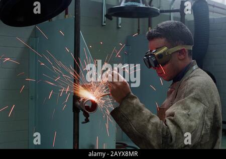 Soldering a metal tube Stock Photo