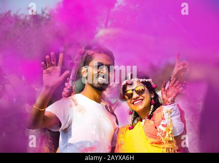 Indian Couple Dancing and Playing With Colors Stock Photo