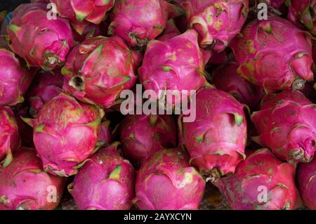 Close-up of dragon fruits (Pitaya) at the morning market in downtown Vientiane, the capital and largest city of Laos. Stock Photo