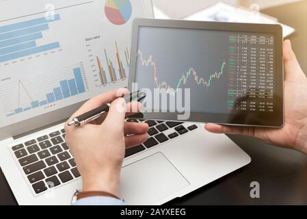 Investor showing stock trading app. Investment, trade concept Stock Photo