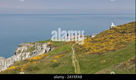 North Devon seascape viewed from the Coast path with Bull Point Lighthouse in the distance Stock Photo