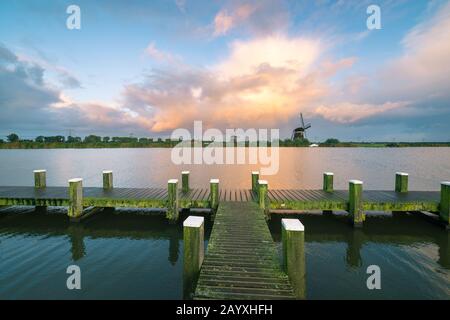 Beautiful landscape image of an autumn shower over a lake in Holland Stock Photo