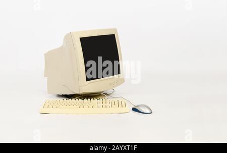 Old computer with keyboard and mouse on white background Stock Photo