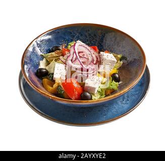 Bulgarian Cuisine: Shopska vegetables salad with feta cheese close-up on a plate, on isolated on white background Stock Photo