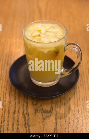 Fresh squeezed apple juice with kaffir lime and cinnamon stick at Anastasia Cafe in Tel Aviv, Israel Stock Photo