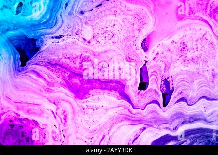 Marble nature texture made as if performed by fluid art technique. The drawing includes swirls of marble. The pattern can be used as background. Stock Photo