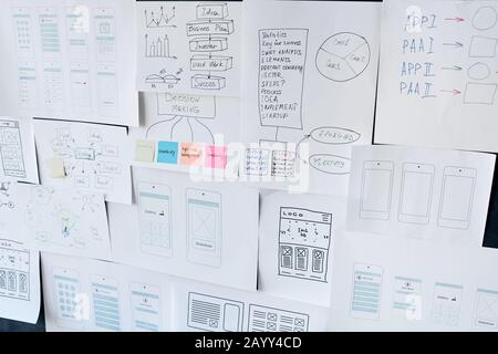 Horizontal no people shot of papers with new application project schemes and sketches fixed on board Stock Photo