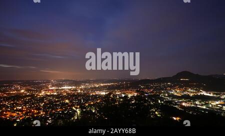 Reutlingen, Germany: Panorama from the Georgenberg mountain over the city at night time Stock Photo